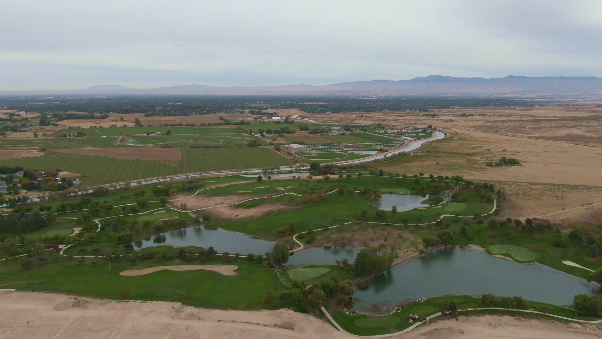 An aerial landscape from the Caterpillar UEM convention film, presented inside the QC picture monitor